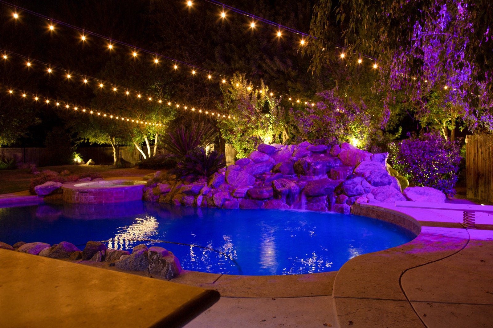 Backyard string lighting installation
