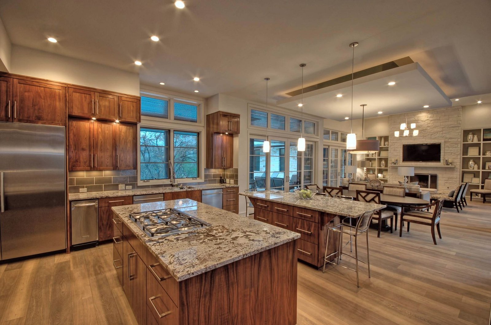 Warm kitchen ceiling, pendant, and under-cabinet lighting