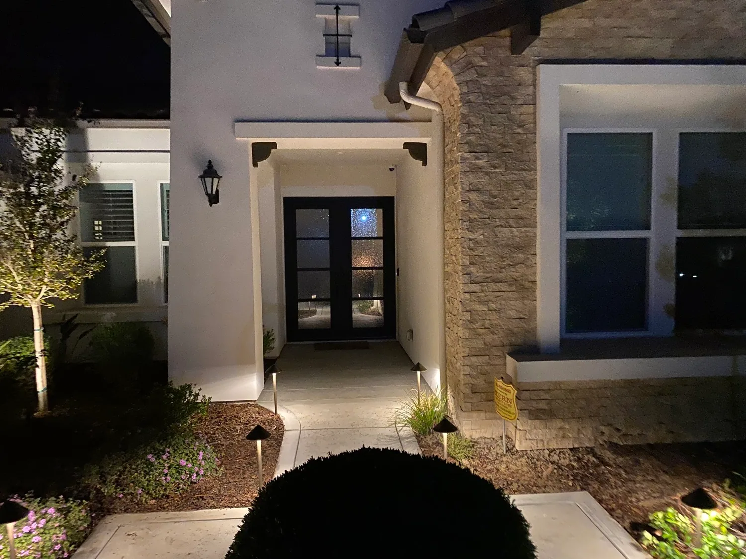 Path lighting leading to a covered front entry