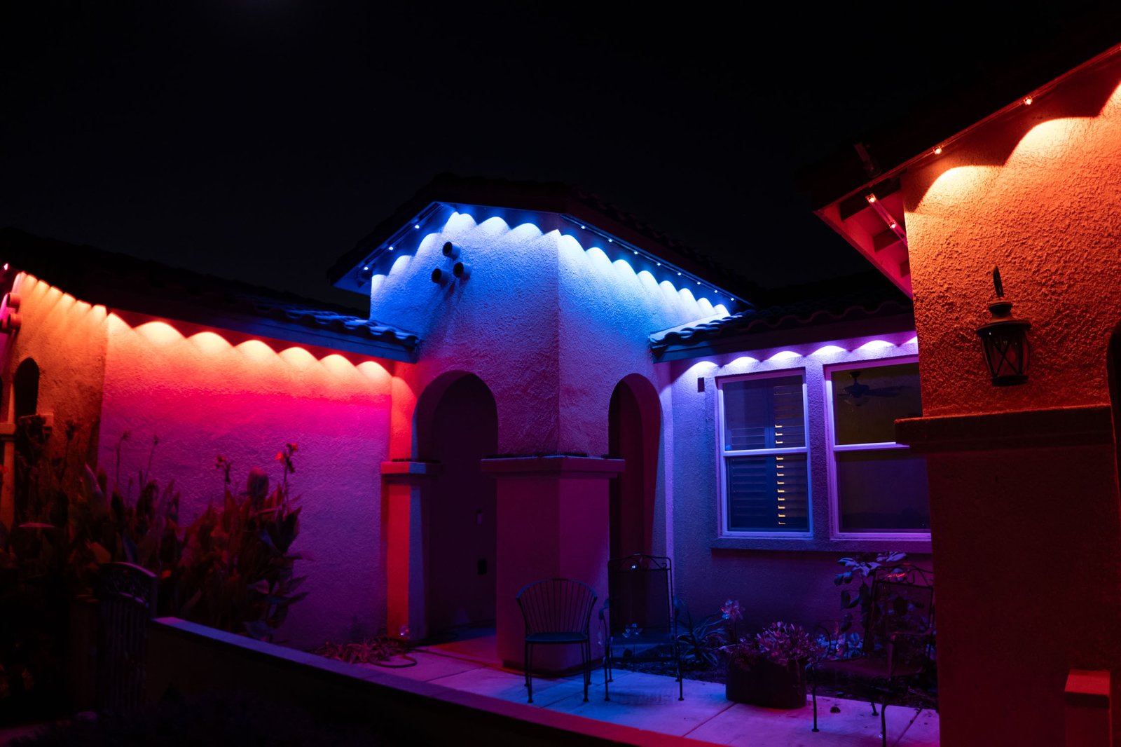 Close permanent roofline lighting install with red, blue, and white colors