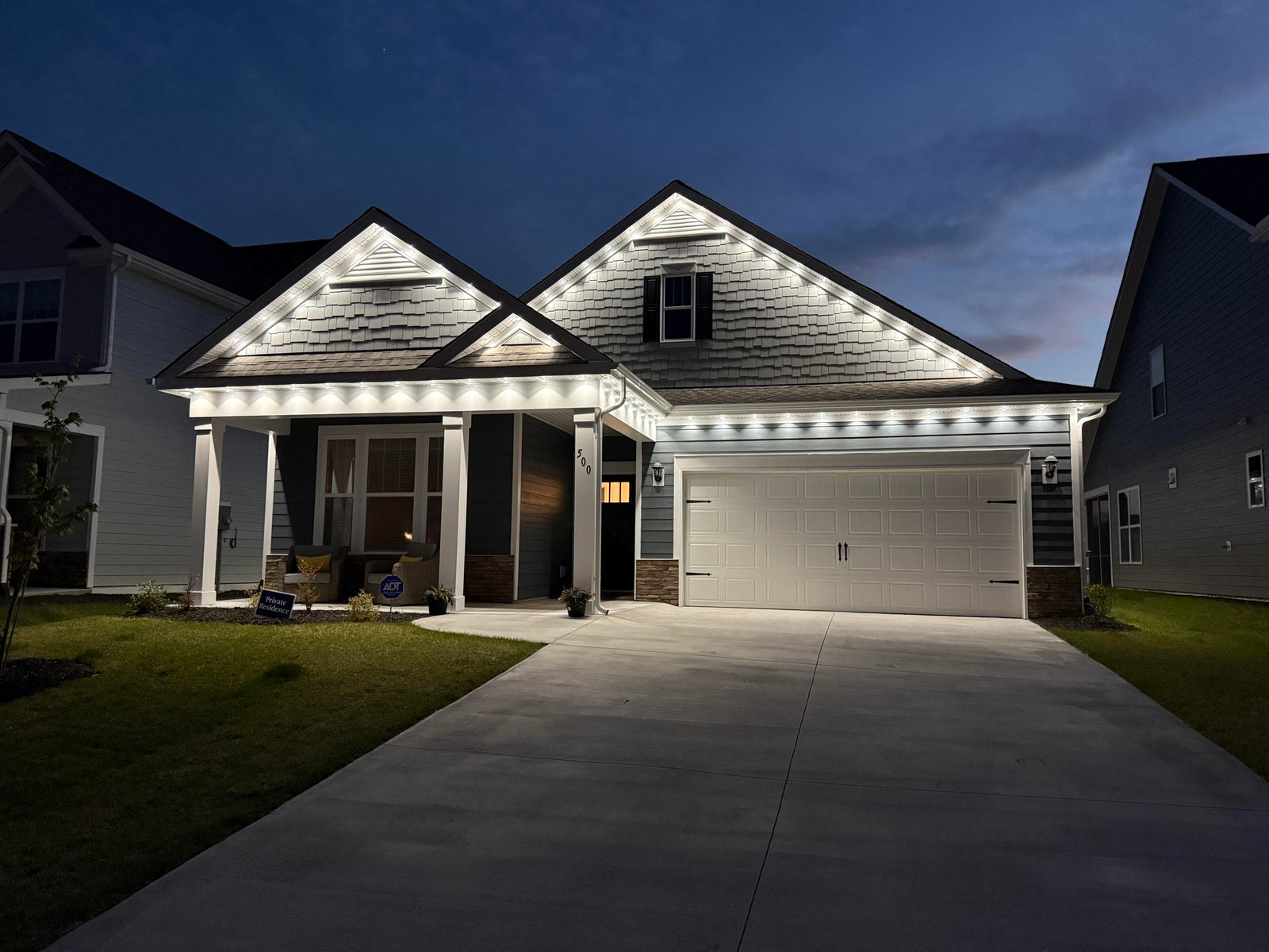 Close detail of permanent roofline lighting installation